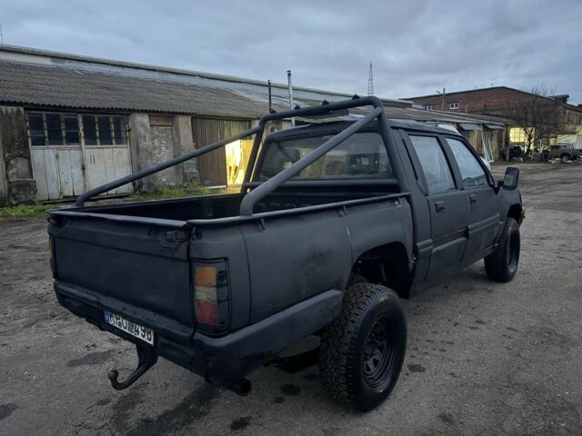 Черный Мицубиси Л 200, объемом двигателя 2.5 л и пробегом 310 тыс. км за 2700 $, фото 1 на Automoto.ua