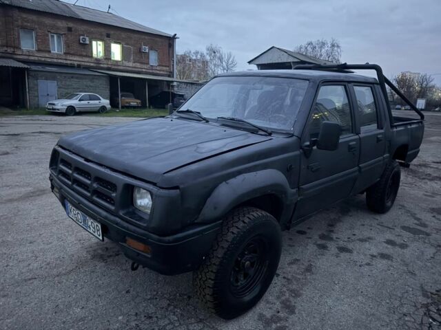 Черный Мицубиси Л 200, объемом двигателя 2.5 л и пробегом 310 тыс. км за 2700 $, фото 3 на Automoto.ua
