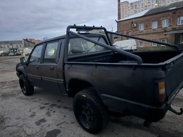 Черный Мицубиси Л 200, объемом двигателя 2.5 л и пробегом 310 тыс. км за 2700 $, фото 4 на Automoto.ua
