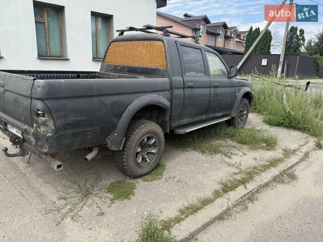 Черный Мицубиси Л 200, объемом двигателя 2.5 л и пробегом 250 тыс. км за 2500 $, фото 3 на Automoto.ua