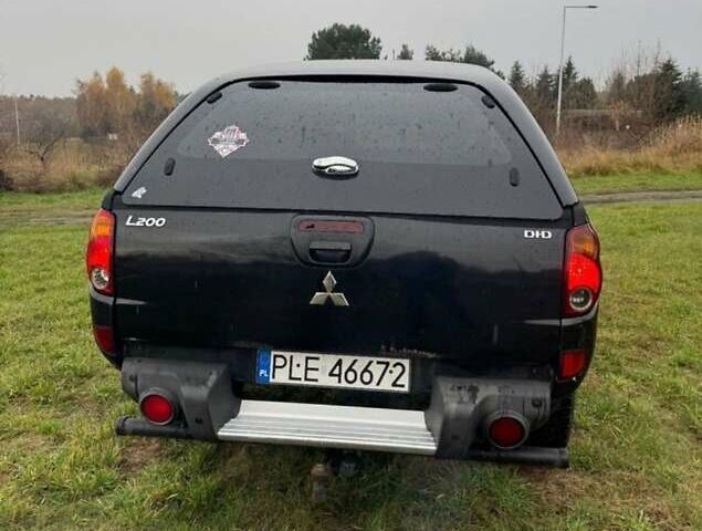 Черный Мицубиси Л 200, объемом двигателя 2.5 л и пробегом 236 тыс. км за 3700 $, фото 5 на Automoto.ua