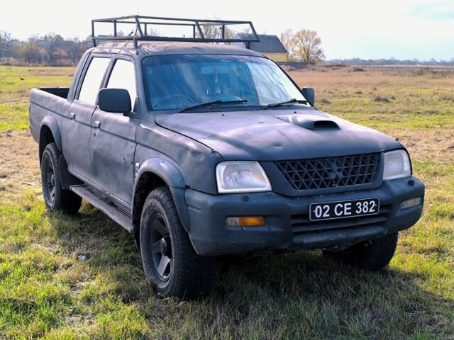 Черный Мицубиси Л 200, объемом двигателя 2.5 л и пробегом 200 тыс. км за 4000 $, фото 2 на Automoto.ua