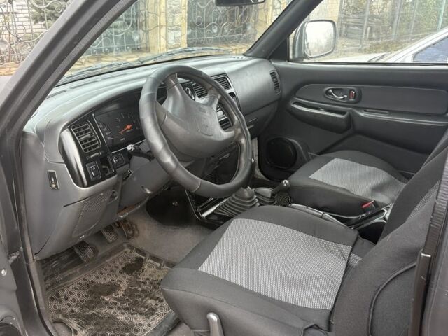 Чорний Міцубісі Л 200, об'ємом двигуна 2.5 л та пробігом 220 тис. км за 5600 $, фото 1 на Automoto.ua