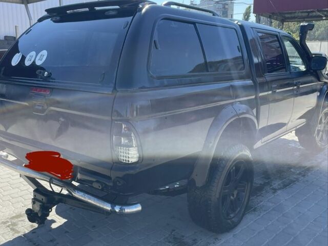 Черный Мицубиси Л 200, объемом двигателя 2.5 л и пробегом 220 тыс. км за 5299 $, фото 2 на Automoto.ua