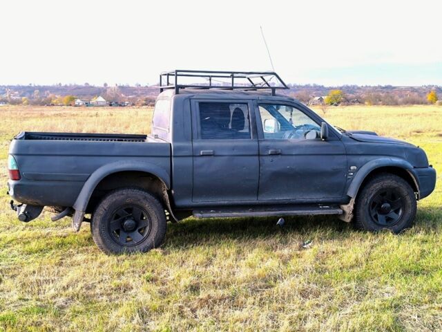 Черный Мицубиси Л 200, объемом двигателя 2.5 л и пробегом 200 тыс. км за 4000 $, фото 6 на Automoto.ua