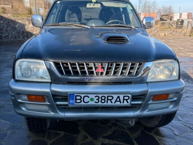 Черный Мицубиси Л 200, объемом двигателя 0 л и пробегом 225 тыс. км за 5205 $, фото 1 на Automoto.ua