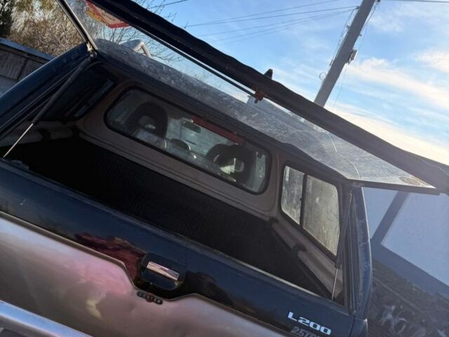Черный Мицубиси Л 200, объемом двигателя 0 л и пробегом 225 тыс. км за 5205 $, фото 7 на Automoto.ua