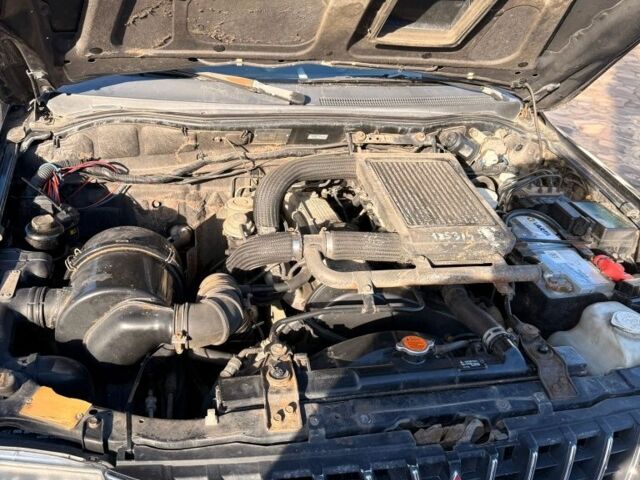 Черный Мицубиси Л 200, объемом двигателя 0 л и пробегом 225 тыс. км за 5205 $, фото 6 на Automoto.ua