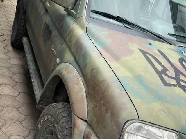 Мицубиси Л 200 2002 в Покровском на Automoto.ua Черный Мицубиси Л 200, объемом двигателя 2.5 л и пробегом 400 тыс. км за 5000 $, фото 7 на Automoto.ua