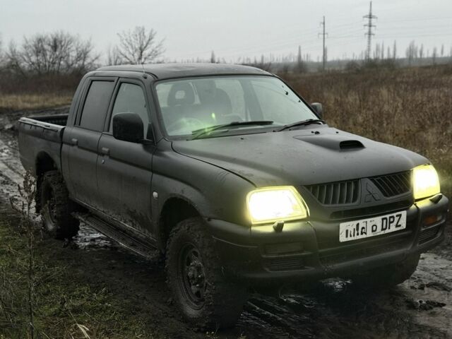 Черный Мицубиси Л 200, объемом двигателя 0 л и пробегом 232 тыс. км за 4100 $, фото 2 на Automoto.ua