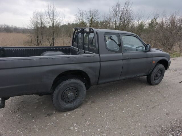 Черный Мицубиси Л 200, объемом двигателя 2.5 л и пробегом 220 тыс. км за 4500 $, фото 8 на Automoto.ua