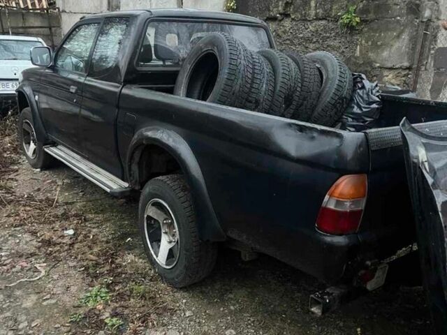 Чорний Міцубісі Л 200, об'ємом двигуна 2.5 л та пробігом 308 тис. км за 5000 $, фото 1 на Automoto.ua