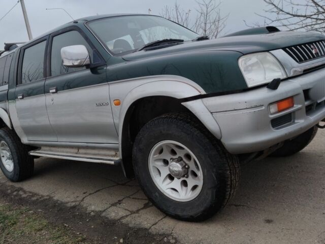 Черный Мицубиси Л 200, объемом двигателя 2.5 л и пробегом 120 тыс. км за 5500 $, фото 18 на Automoto.ua