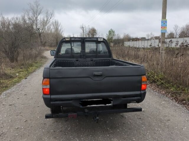 Черный Мицубиси Л 200, объемом двигателя 2.5 л и пробегом 220 тыс. км за 4500 $, фото 4 на Automoto.ua