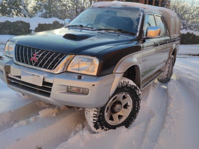 Черный Мицубиси Л 200, объемом двигателя 2.5 л и пробегом 120 тыс. км за 5500 $, фото 5 на Automoto.ua