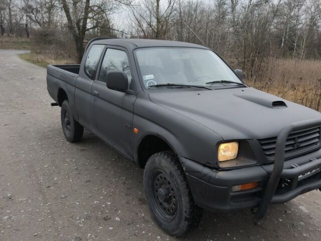 Черный Мицубиси Л 200, объемом двигателя 2.5 л и пробегом 220 тыс. км за 4500 $, фото 10 на Automoto.ua