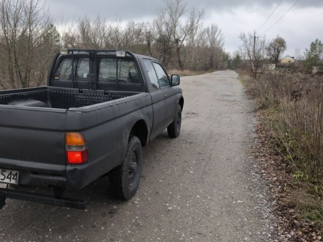 Черный Мицубиси Л 200, объемом двигателя 2.5 л и пробегом 220 тыс. км за 4500 $, фото 7 на Automoto.ua