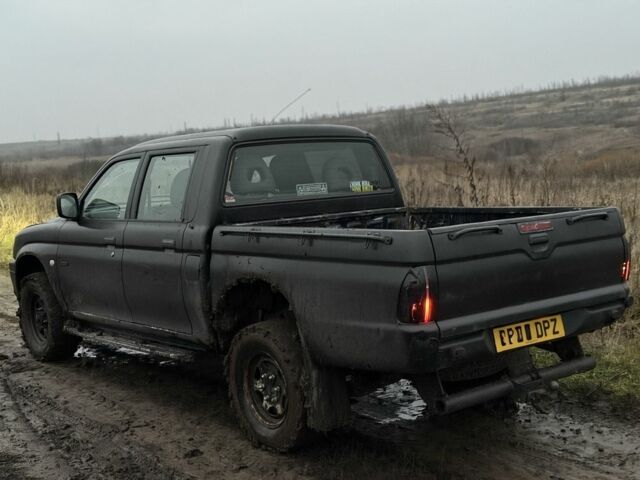 Черный Мицубиси Л 200, объемом двигателя 0 л и пробегом 232 тыс. км за 4100 $, фото 5 на Automoto.ua