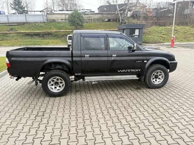 Чорний Міцубісі Л 200, об'ємом двигуна 2.5 л та пробігом 167 тис. км за 6647 $, фото 7 на Automoto.ua