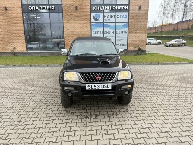 Чорний Міцубісі Л 200, об'ємом двигуна 2.5 л та пробігом 167 тис. км за 6647 $, фото 2 на Automoto.ua