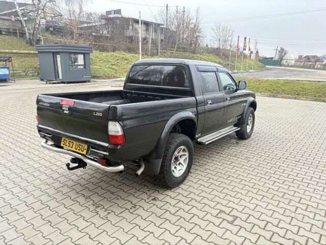 Чорний Міцубісі Л 200, об'ємом двигуна 2.5 л та пробігом 167 тис. км за 6647 $, фото 6 на Automoto.ua