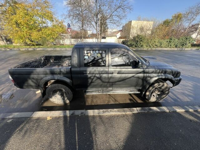 Черный Мицубиси Л 200, объемом двигателя 2.5 л и пробегом 270 тыс. км за 3500 $, фото 1 на Automoto.ua