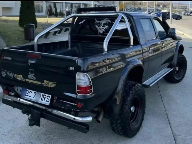 Мицубиси Л 200 2003 в Сумах на Automoto.ua Черный Мицубиси Л 200, объемом двигателя 2.5 л и пробегом 255 тыс. км за 2500 $, фото 2 на Automoto.ua