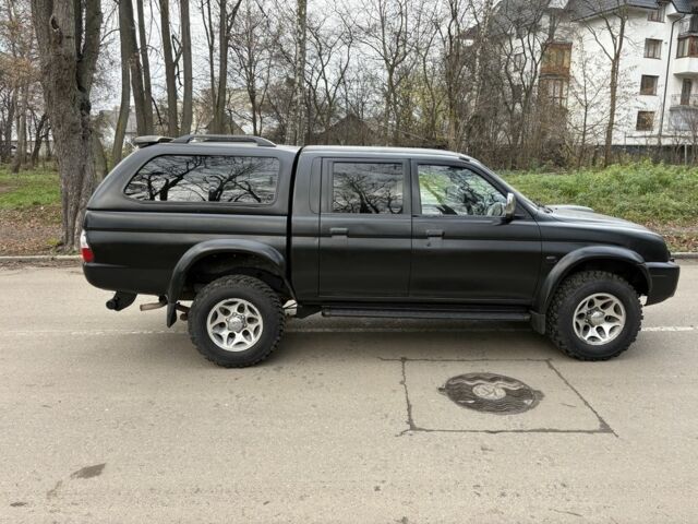 Чорний Міцубісі Л 200, об'ємом двигуна 2.5 л та пробігом 167 тис. км за 5674 $, фото 1 на Automoto.ua