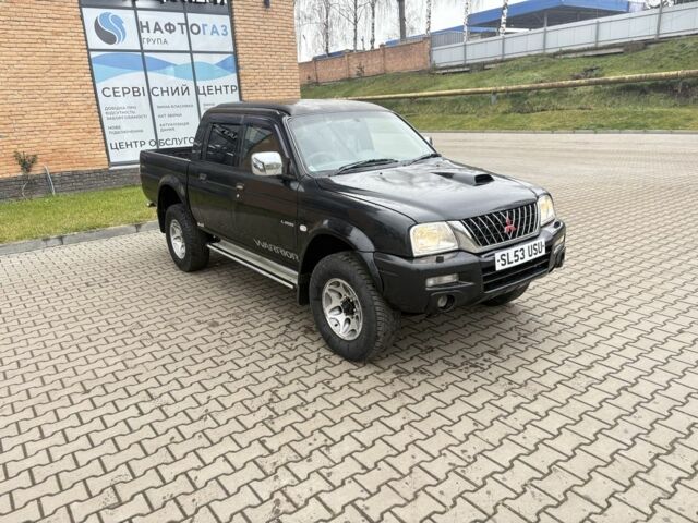 Чорний Міцубісі Л 200, об'ємом двигуна 2.5 л та пробігом 167 тис. км за 6647 $, фото 1 на Automoto.ua