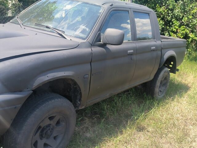 Черный Мицубиси Л 200, объемом двигателя 0 л и пробегом 530 тыс. км за 4100 $, фото 1 на Automoto.ua