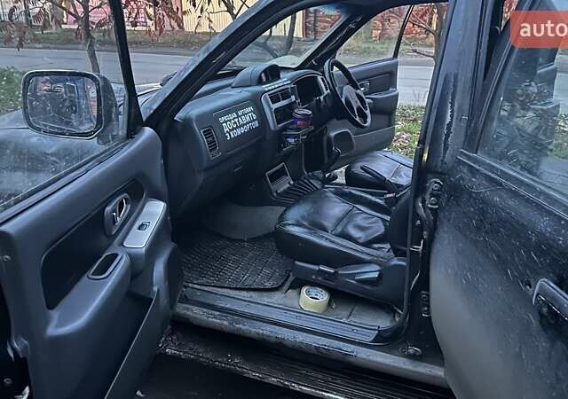 Черный Мицубиси Л 200, объемом двигателя 0 л и пробегом 300 тыс. км за 5000 $, фото 6 на Automoto.ua