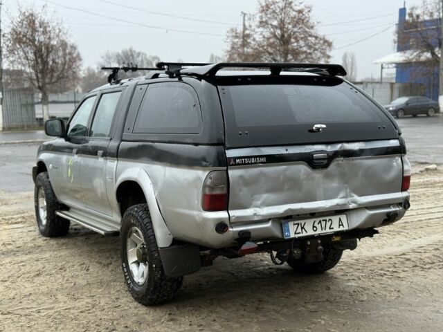 Черный Мицубиси Л 200, объемом двигателя 2.5 л и пробегом 355 тыс. км за 4500 $, фото 3 на Automoto.ua