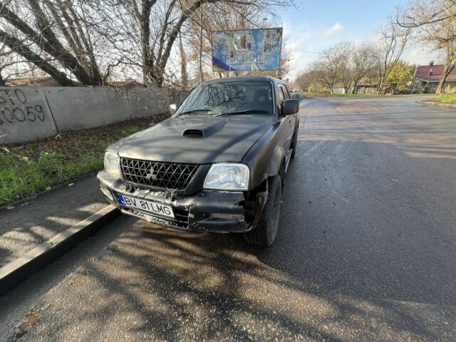 Черный Мицубиси Л 200, объемом двигателя 2.5 л и пробегом 270 тыс. км за 3500 $, фото 3 на Automoto.ua