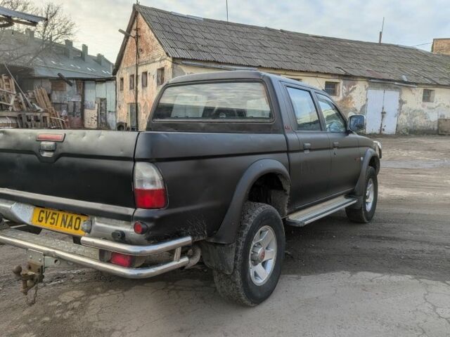 Черный Мицубиси Л 200, объемом двигателя 2.5 л и пробегом 165 тыс. км за 4830 $, фото 2 на Automoto.ua