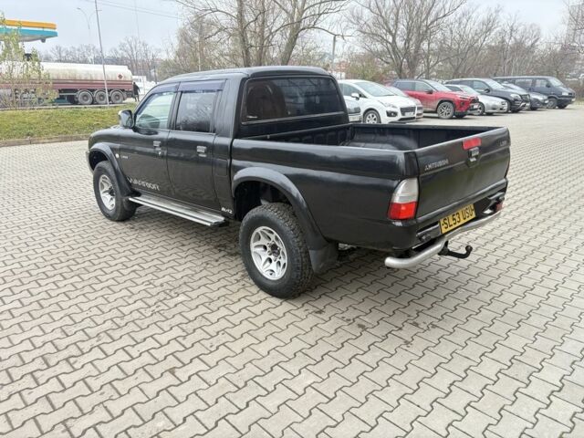 Чорний Міцубісі Л 200, об'ємом двигуна 2.5 л та пробігом 167 тис. км за 6647 $, фото 4 на Automoto.ua