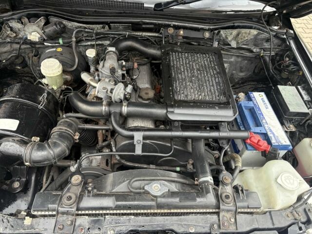 Чорний Міцубісі Л 200, об'ємом двигуна 2.5 л та пробігом 167 тис. км за 6647 $, фото 13 на Automoto.ua