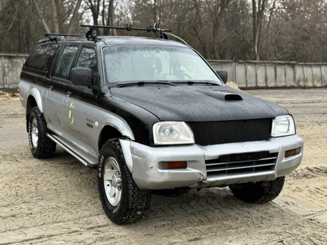 Черный Мицубиси Л 200, объемом двигателя 2.5 л и пробегом 355 тыс. км за 4500 $, фото 1 на Automoto.ua