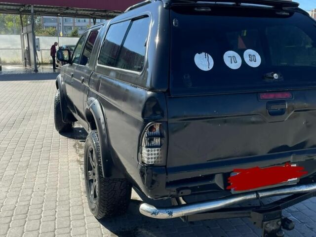 Черный Мицубиси Л 200, объемом двигателя 2.5 л и пробегом 225 тыс. км за 4450 $, фото 1 на Automoto.ua