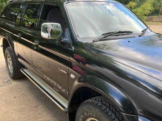 Черный Мицубиси Л 200, объемом двигателя 0 л и пробегом 150 тыс. км за 4667 $, фото 11 на Automoto.ua