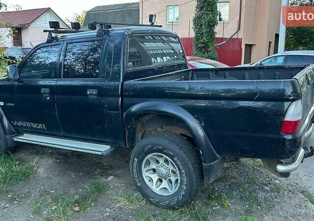 Чорний Міцубісі Л 200, об'ємом двигуна 2.5 л та пробігом 240 тис. км за 6054 $, фото 1 на Automoto.ua