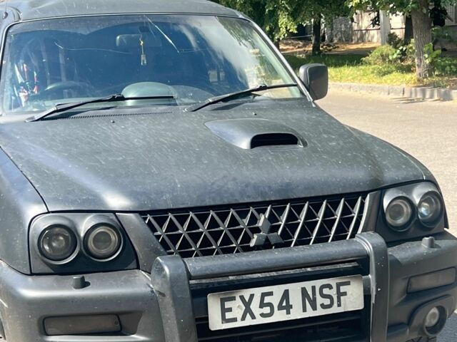 Чорний Міцубісі Л 200, об'ємом двигуна 2.5 л та пробігом 250 тис. км за 4500 $, фото 1 на Automoto.ua