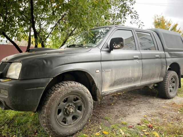 Чорний Міцубісі Л 200, об'ємом двигуна 2.5 л та пробігом 3 тис. км за 3700 $, фото 1 на Automoto.ua