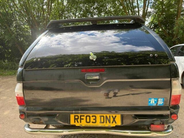 Черный Мицубиси Л 200, объемом двигателя 0 л и пробегом 150 тыс. км за 4667 $, фото 7 на Automoto.ua