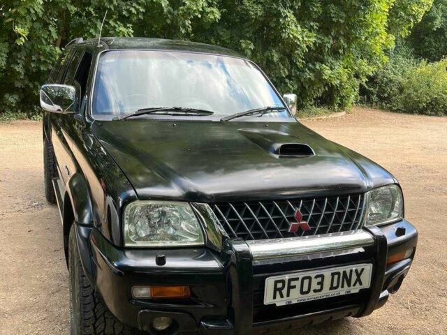 Черный Мицубиси Л 200, объемом двигателя 0 л и пробегом 150 тыс. км за 4667 $, фото 2 на Automoto.ua