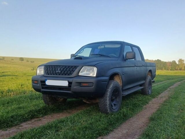 Черный Мицубиси Л 200, объемом двигателя 2.5 л и пробегом 280 тыс. км за 5300 $, фото 1 на Automoto.ua