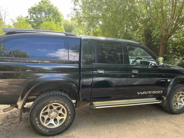 Черный Мицубиси Л 200, объемом двигателя 0 л и пробегом 150 тыс. км за 4667 $, фото 1 на Automoto.ua