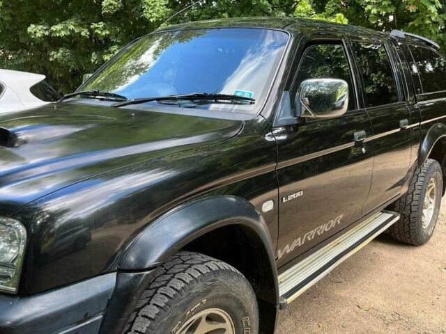 Черный Мицубиси Л 200, объемом двигателя 0 л и пробегом 150 тыс. км за 4667 $, фото 9 на Automoto.ua