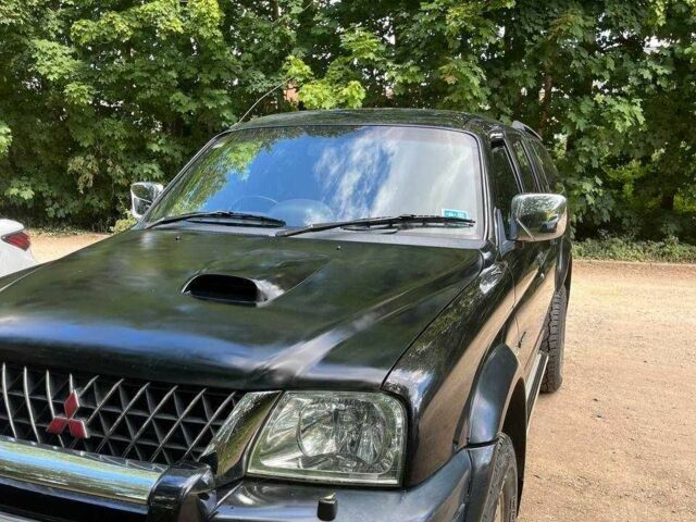 Черный Мицубиси Л 200, объемом двигателя 0 л и пробегом 150 тыс. км за 4667 $, фото 10 на Automoto.ua