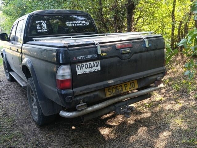 Чорний Міцубісі Л 200, об'ємом двигуна 2.5 л та пробігом 150 тис. км за 4800 $, фото 1 на Automoto.ua