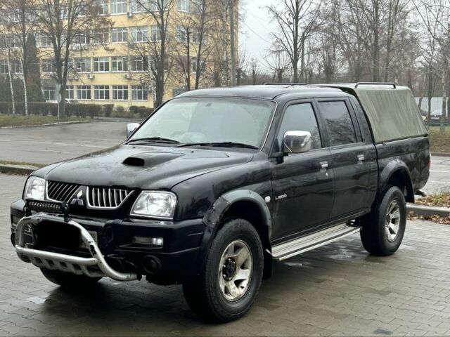 Черный Мицубиси Л 200, объемом двигателя 2.5 л и пробегом 170 тыс. км за 4250 $, фото 6 на Automoto.ua